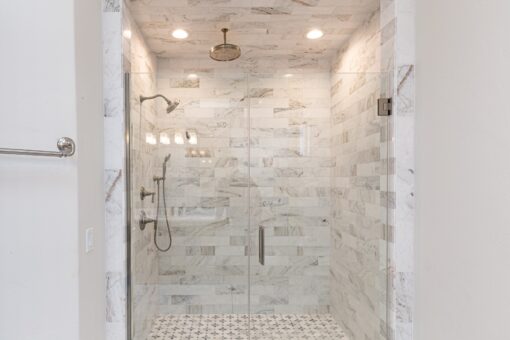 Prescott walk-in glass shower with marble tile
