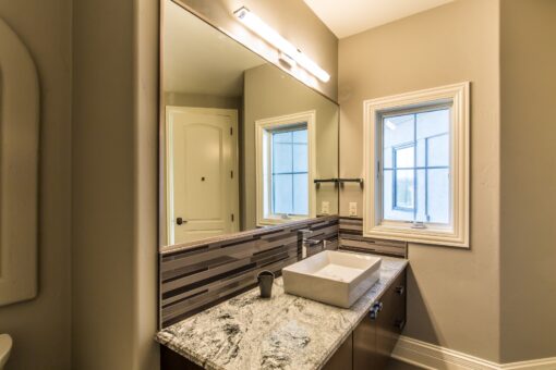 Presidio bathroom with vessel sink and granite counter
