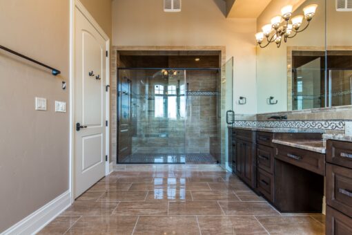 Presidio primary bath glass shower and dark vanity