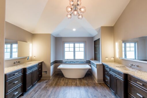 Compton primary bath freestanding tub and dark vanities