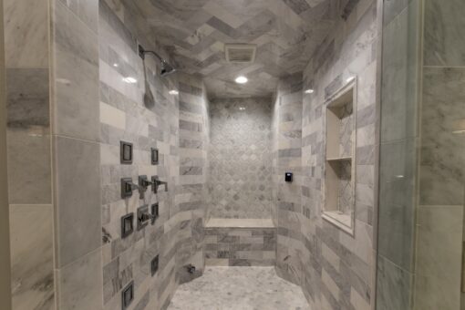 Kingfogl custom home marble walk-in shower with multiple shower heads and bench