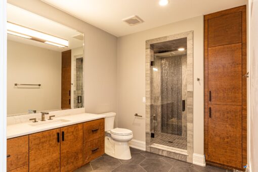 Birchwood bathroom with wood vanity and glass shower