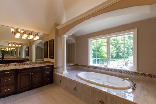 Rivendell primary bath soaking tub beneath windows