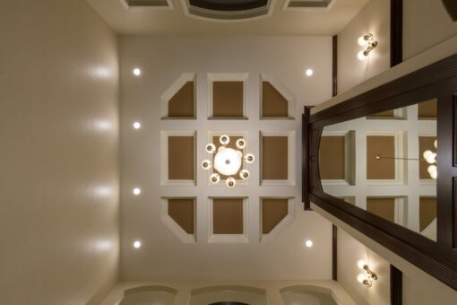 Kingfogl custom home grid coffered ceiling with round chandelier