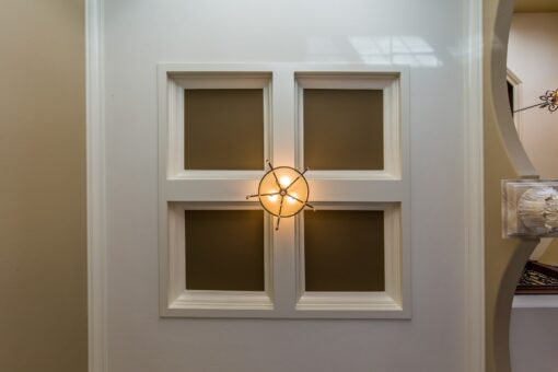 Kingfogl custom home paneled ceiling detail with sconce-style fixture