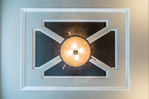 Kingfogl custom home tray ceiling with dark inlay panels and dome light