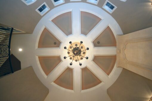 Kingfogl custom home domed rotunda ceiling with radiating panels and chandelier