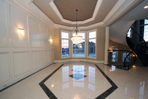 Haven dining room with tray ceiling and marble inlay floor