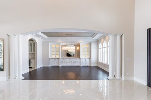 Prescott open living area with built-ins and hardwood floors