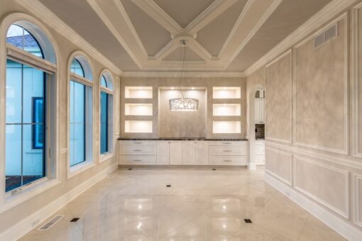 Kingfogl custom home dining room with arched windows and lit built-ins