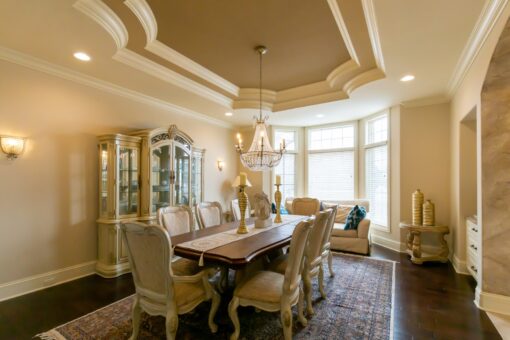 Summerhill dining room with tray ceiling and chandelier