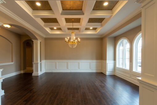 Grand Haven dining room with coffered ceiling and wainscoting