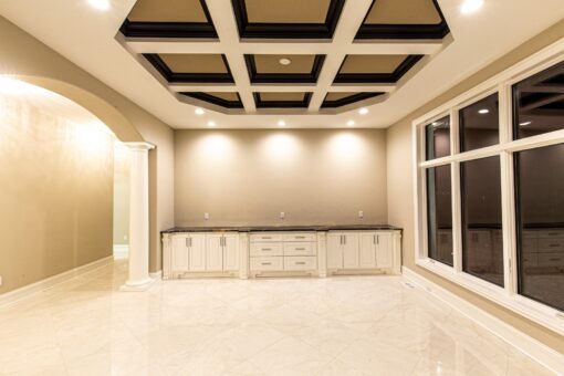 Kingfogl custom home dining room with dark coffered ceiling and built-in buffet