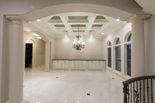 Callista dining room with coffered ceiling and chandelier