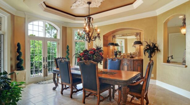Buckingham dining room with chandelier and arched window