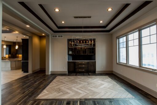 Compton dining room with tray ceiling and built-in bar