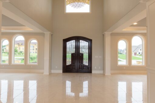 Ravenna foyer with arched wood entry doors