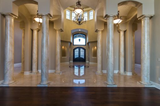 Presidio foyer with columns and arched entry doors