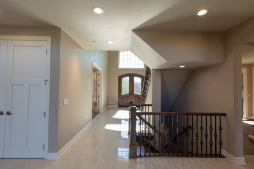 Auburn foyer with arched entry doors and staircase