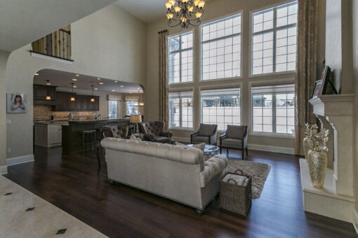 Kingfogl custom home two-story great room with window wall and view to the kitchen
