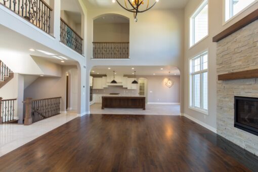 Auburn great room with balcony and view to the kitchen