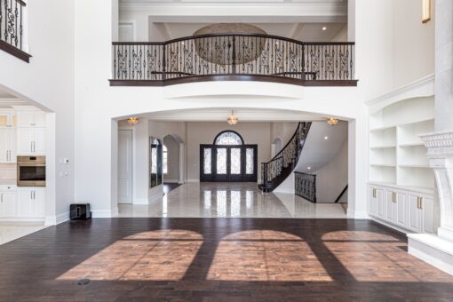 Prescott two-story great room with balcony and arched windows