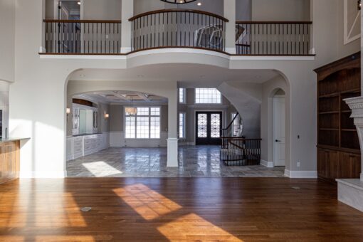 Birchwood great room with balcony and hardwood floors