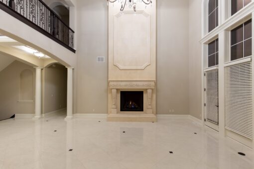 Vizzini great room fireplace with balcony and columns
