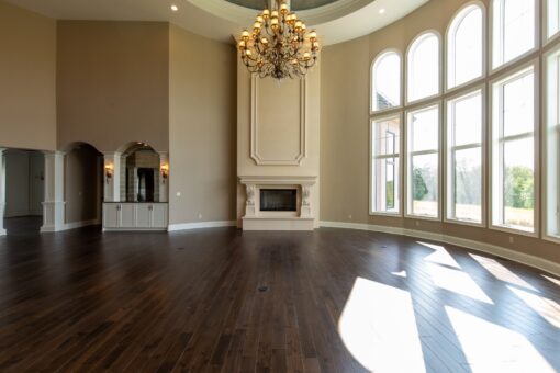Grand Haven two-story great room with fireplace and window wall