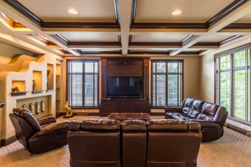 Brandywine hearth room with coffered ceiling and built-in media wall