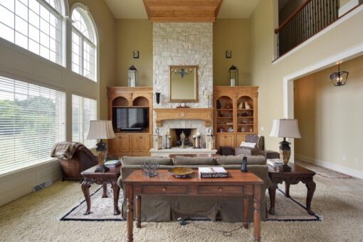 Kingfogl custom home great room with stone fireplace, built-ins and window wall