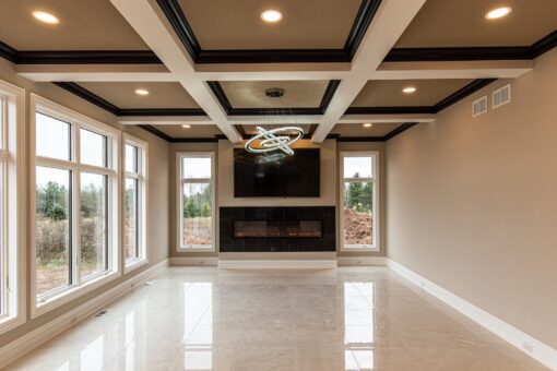 Saddlebrook hearth room with coffered ceiling and fireplace