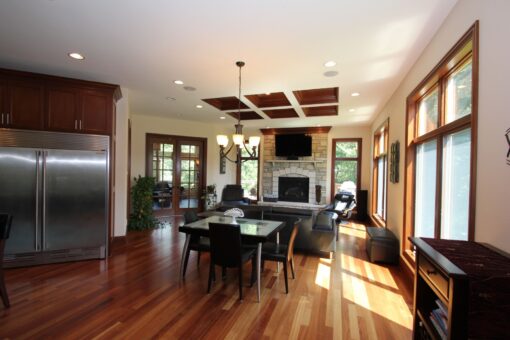 Kingfogl custom home hearth room with fireplace and view from the kitchen