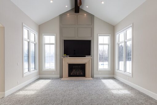 Prescott hearth room with fireplace and tall windows