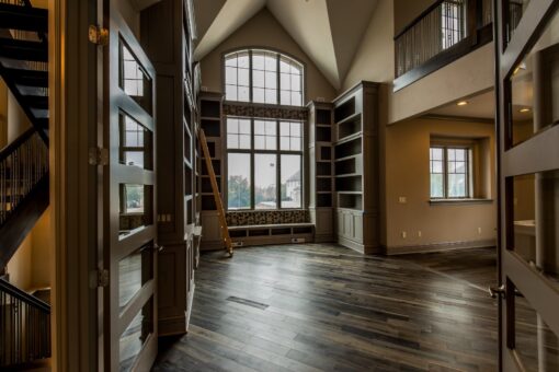 Compton hearth room with arched window and built-ins