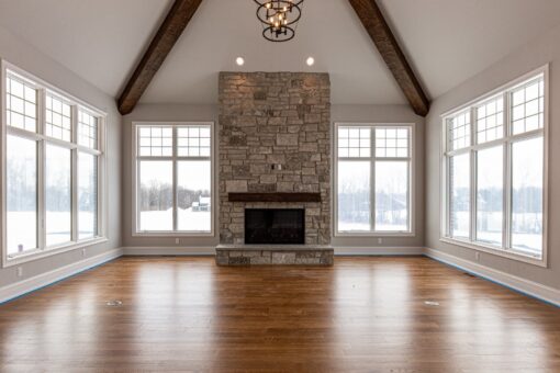 Birchwood hearth room with stone fireplace and timber beams