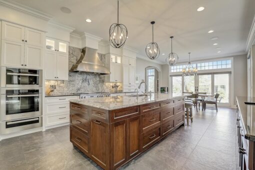 Wildwood kitchen with wood island and lantern pendants