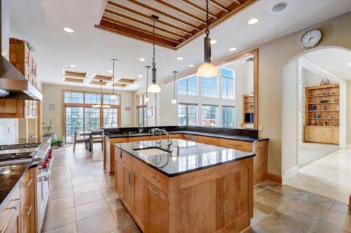 Ridgeview kitchen with maple cabinetry, two islands and wood ceiling