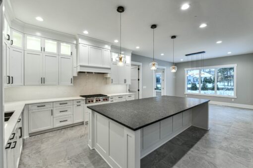 Hawks Ridge white kitchen with black granite island