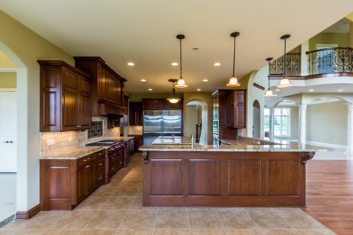Richland kitchen with granite island and pendant lights