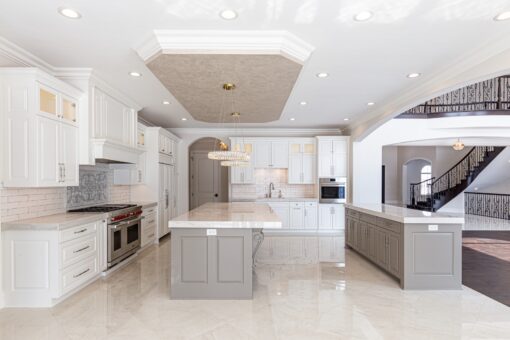 Prescott white kitchen with gray island and range wall