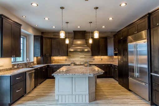 Compton kitchen with white island and dark cabinetry