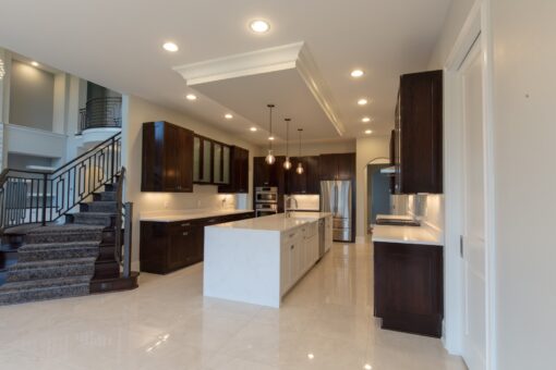 Ravenna kitchen with white island and dark cabinetry