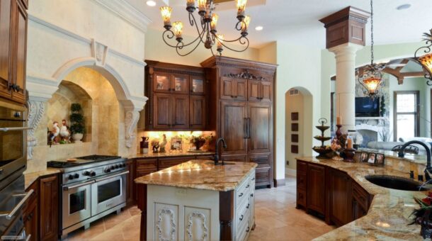 Buckingham kitchen with dark wood cabinetry and granite island