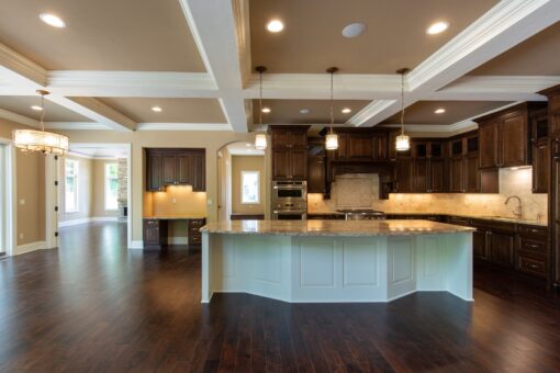 Rivendell kitchen with dark cabinetry and white island
