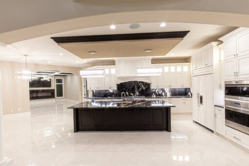 Saddlebrook kitchen with long dark island and coffered ceiling