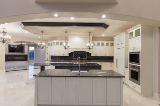 Callista kitchen island with black granite and stainless appliances