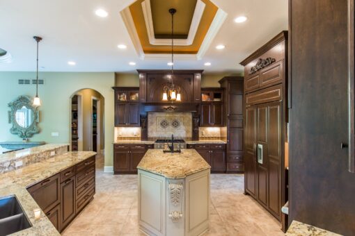 Brandywine kitchen with dark cabinetry and granite island under a domed ceiling