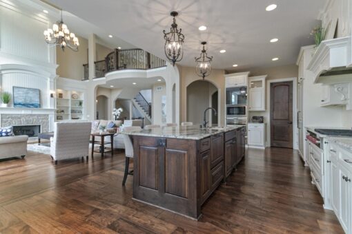 Bradon kitchen with dark island and balcony above