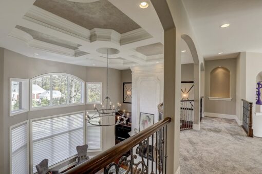 Wildwood great room with coffered ceiling and balcony
